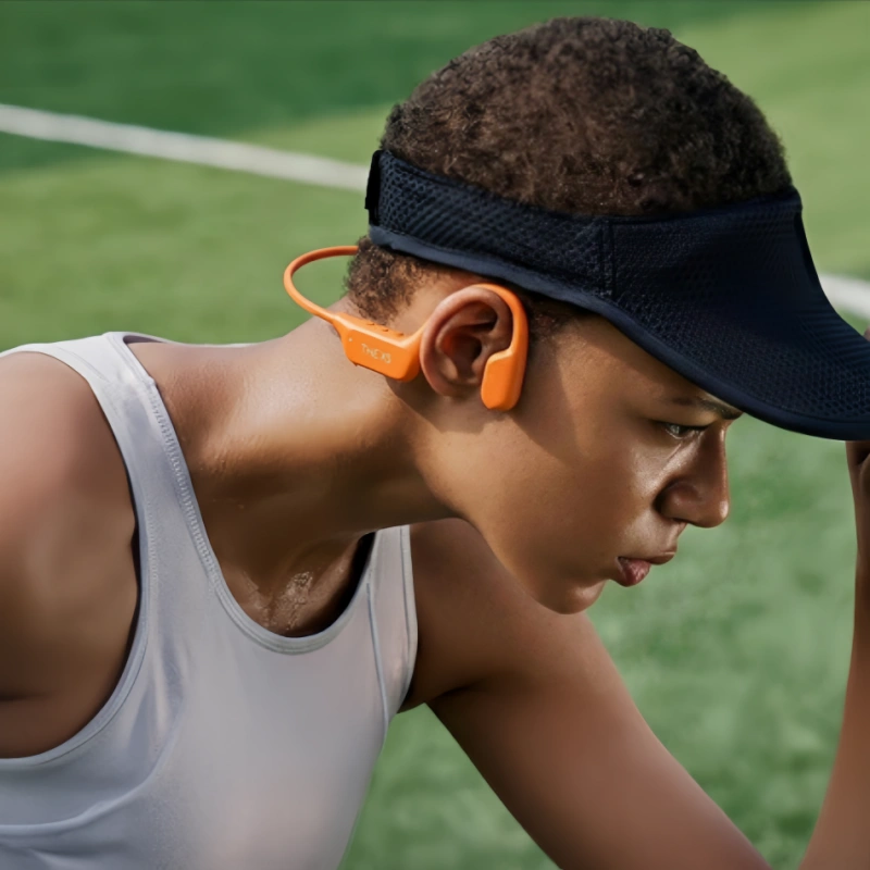 X5 bone conduction headphone rest on the cheekbone of a black athlete